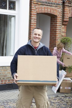 Removal team helping a family move from a Harrow home