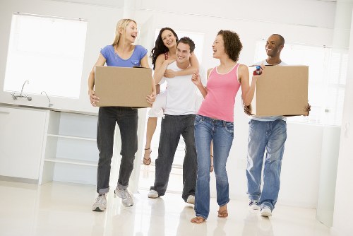 Removal crew loading office items carefully for a business move in Harrow
