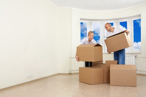 Careful loading of boxes and furniture by a man and van team