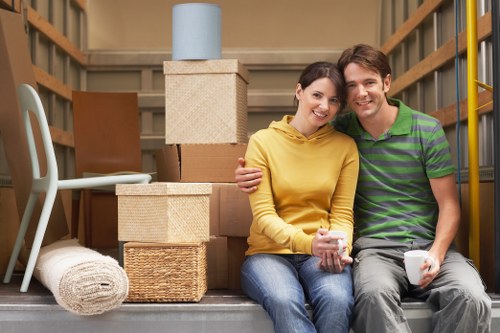 Packed moving boxes and furniture ready for transport in Harrow