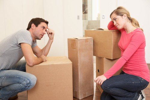 Packed office boxes and furniture ready for transport during a Harrow relocation