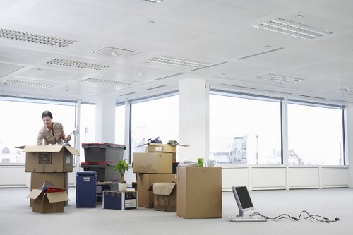 Business equipment and office furniture being prepared for relocation in Harrow